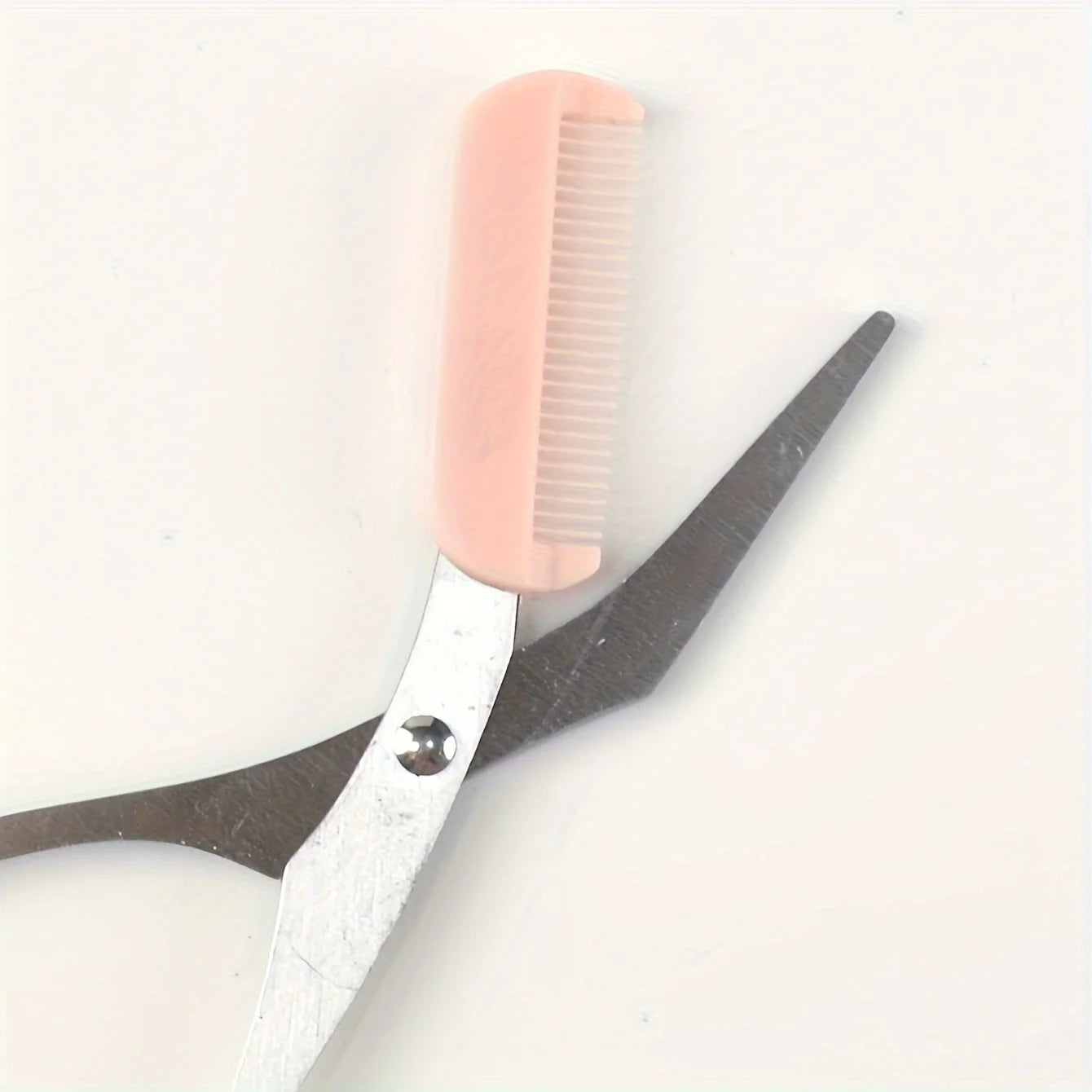 Pink eyebrow trimming scissors with built-in comb - stainless steel, creating perfect eyebrows