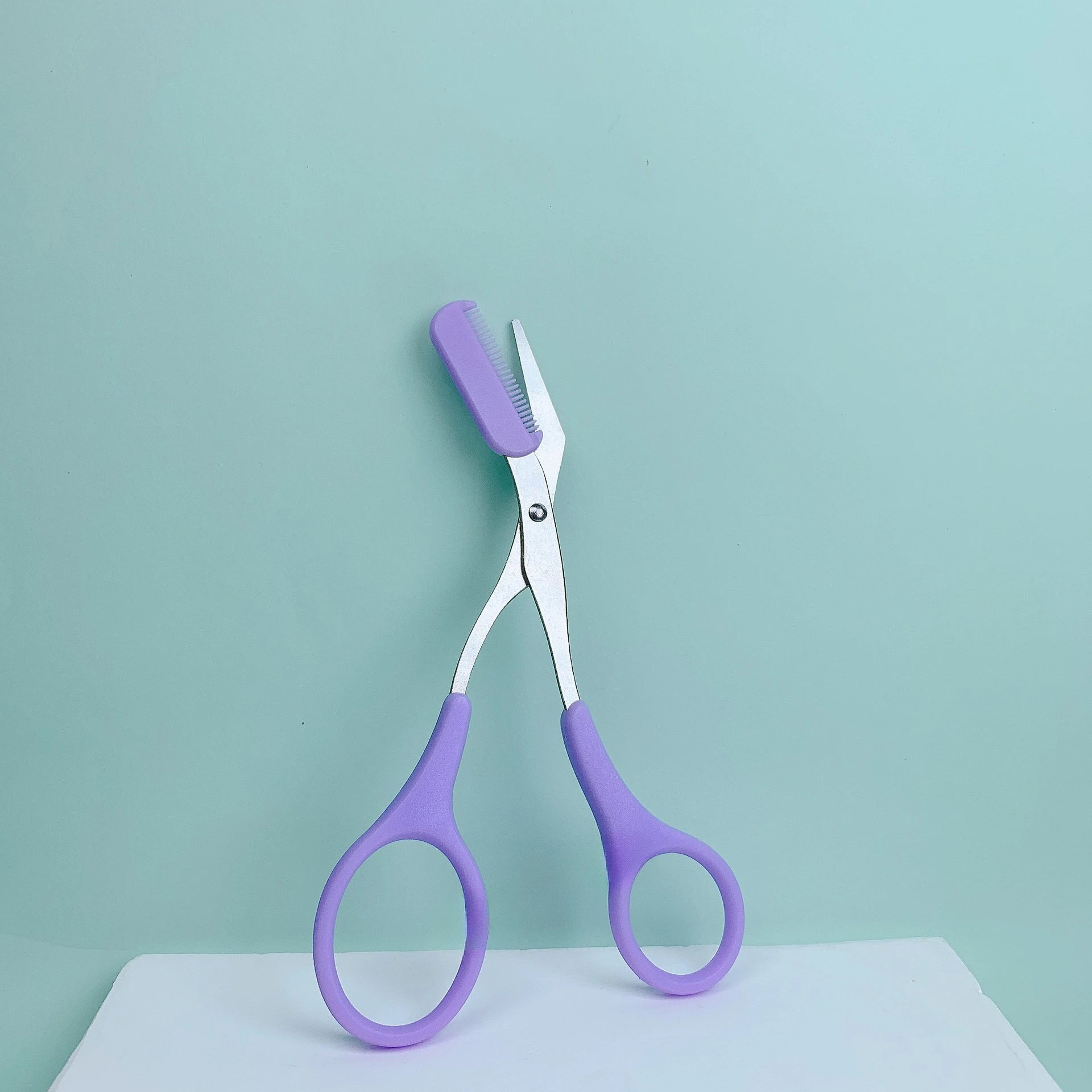Pink eyebrow trimming scissors with built-in comb - stainless steel, creating perfect eyebrows