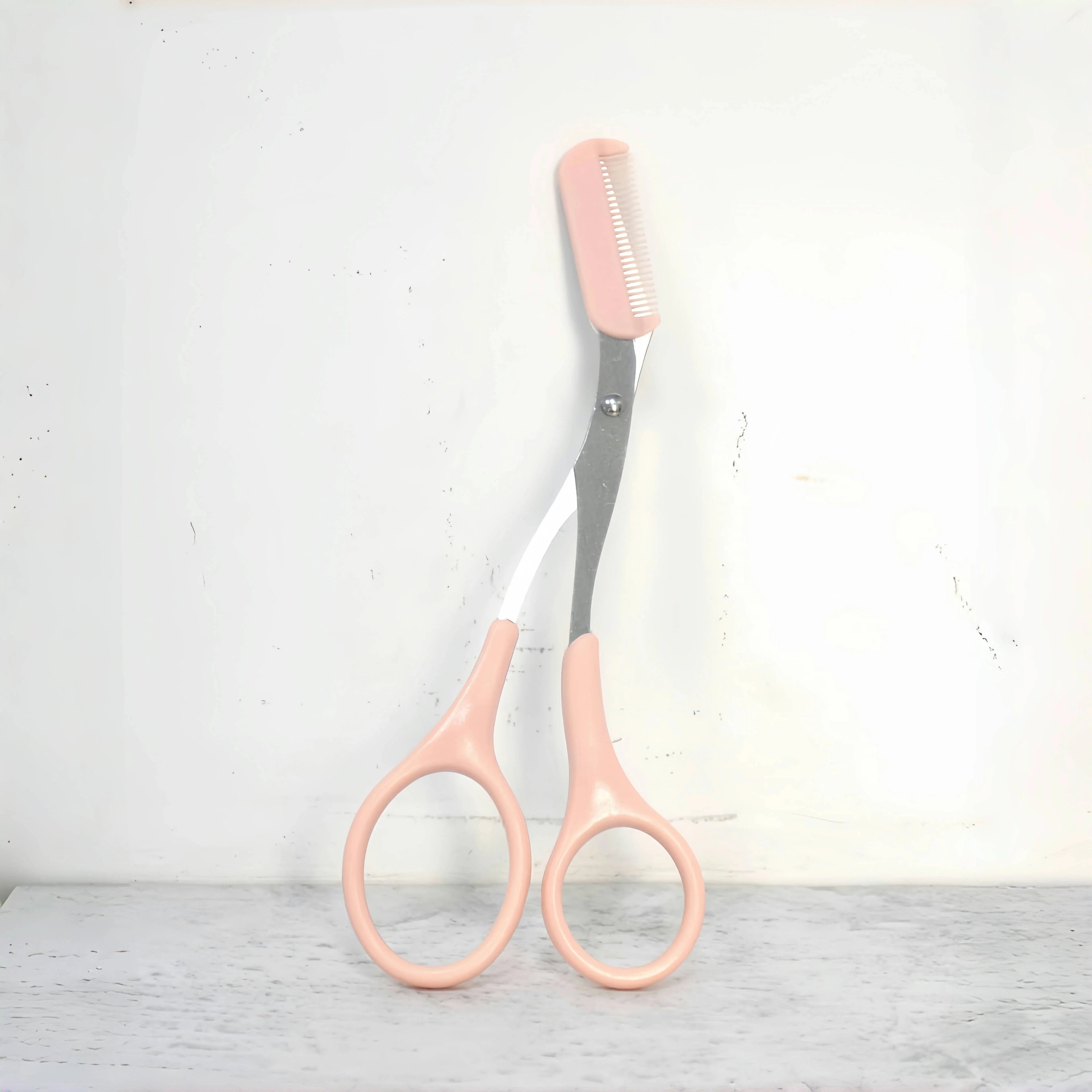 Pink eyebrow trimming scissors with built-in comb - stainless steel, creating perfect eyebrows