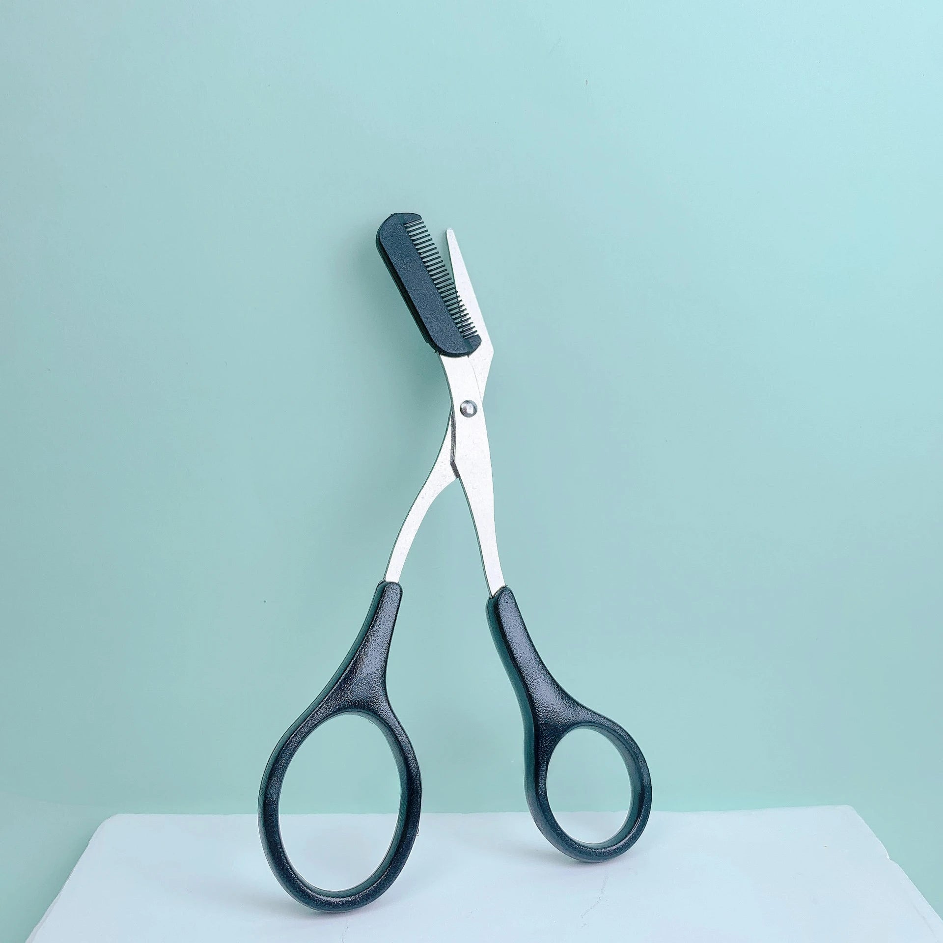 Pink eyebrow trimming scissors with built-in comb - stainless steel, creating perfect eyebrows