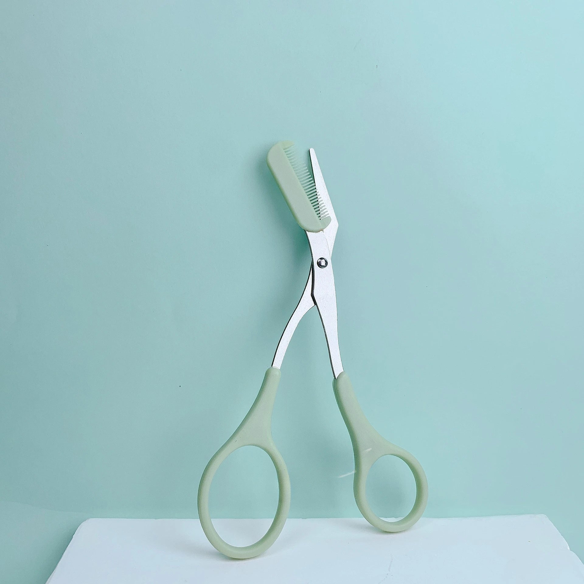 Pink eyebrow trimming scissors with built-in comb - stainless steel, creating perfect eyebrows
